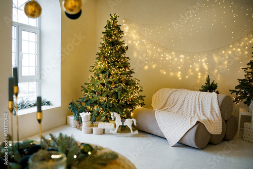 Christmas tree. A bright room decorated with Christmas toys and decorations.