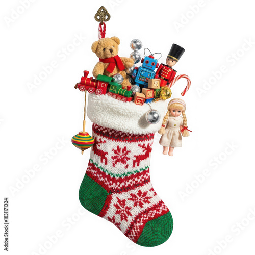 Knitted Christmas stocking overflowing with vintage toys and candy cane isolated on a transparent background
