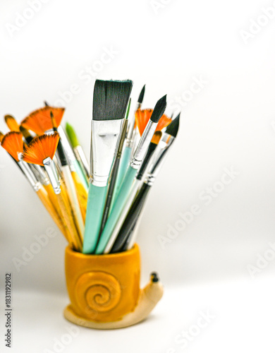 Cup of paintbrushes as seen from the front