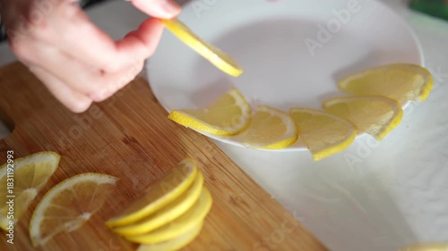 Crafting a citrus Symphony lemon Slices Arranged with precision on White Plate, afternoon light