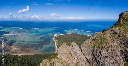 Aerial view of Le Morne Mountain summit with peninsula and ocean, Mauritius