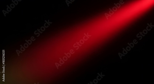 Dramatic spotlight effect with deep red hues against a stark black backdrop, perfect for adding intensity and mood to your designs and creative projects