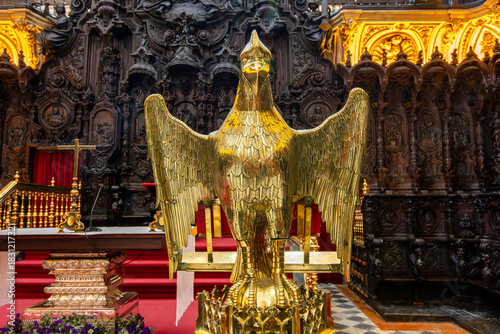 Golden eagle sculpture in Choirs of Capilla Mayor in Mezquita (Great Mosque of Cordoba), Spain