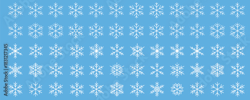 Delicate winter snowflakes on light blue background for elegant holiday designs and festive season marketing campaigns