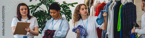 Banner. Group of volunteers, young women, man, sorting clothes in charitable foundation for charity donation, recycling. Concept of textile pollution, conscious consumption. Ecology, sustainable life