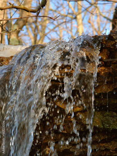 Small waterfall of melting snow at Kickapoo State Park in Illinois