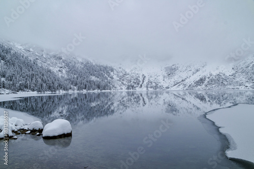 Fototapeta Naklejka Na Ścianę i Meble -  Morskie Oko Lake Covered in Ice at Winter in Tatra Mountains Poland.