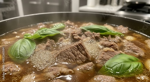 Close-up of a hearty homemade beef stew simmering in a pot with fresh basil leaves, a comforting and savory meal
