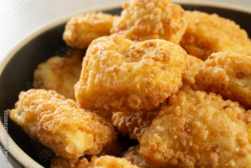 A closeup view of a bowl of gluten-free chicken nuggets.