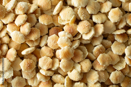 Schilderij op canvas A top down view of a pile of oyster crackers, as a background.