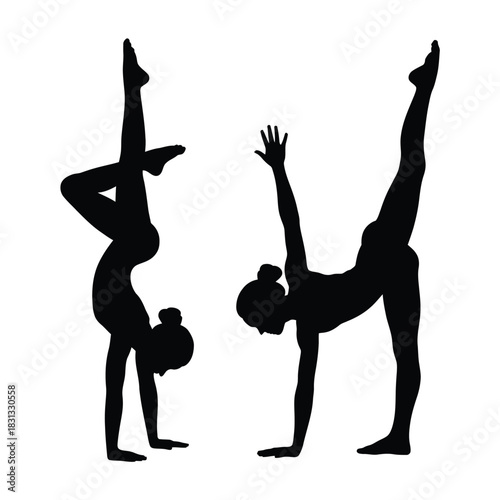 Two silhouetted gymnasts performing handstand poses