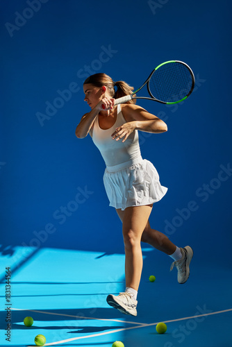 Tennis player in action during a practice session indoors