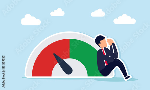 Businessman sitting sadly near level indicator pointing to red showing disappointment with unexpected business performance