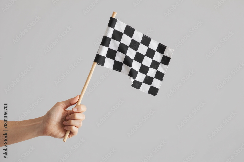 Obraz premium checkered race flag in hand.