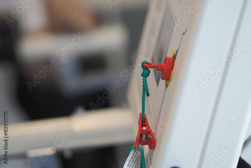 Cuadro en lienzo Safety cord on medical equipment in a clinical setting
