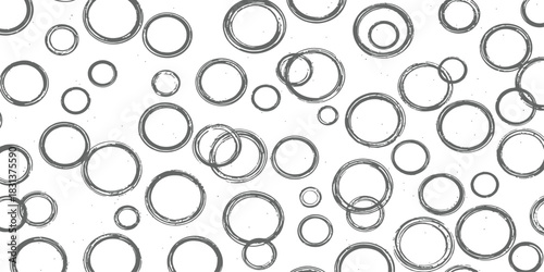 Abstract monochrome seamless pattern of distressed charcoal grunge hand drawn circles