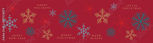 Christmas baubles arranged on a blue background, creating a festive holiday card design. Decorative Christmas ornaments forming a border. Merry Christmas and Happy New Year backdrop.