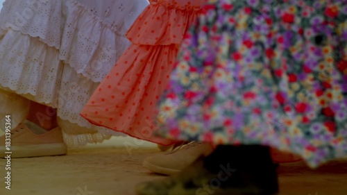 A woman’s silhouette bathed in warm sunrise light, symbolizing faith and quiet devotion on the Rocío route