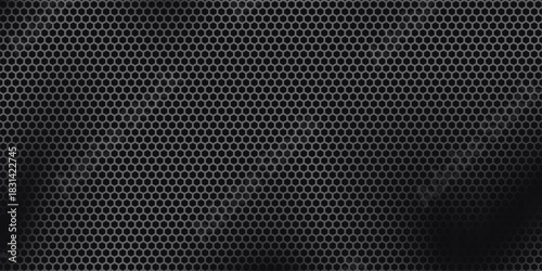 Black perforated metal plate. Metal grill. Black metal texture steel background. Perforated sheet metal.Abstract dark gray circle mesh pattern background texture.Black metallic background.