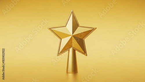Elegant golden star topper shining brightly against a matching gold background for festive holiday celebrations and awards ceremonies