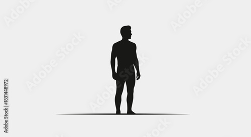 Confident silhouette of a man standing strong, looking forward with purpose and determination, representing strength and ambition.