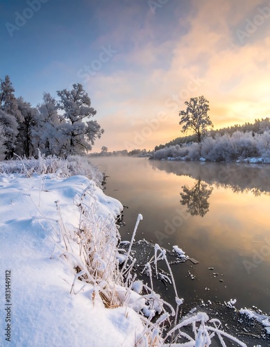 Snowy landscape featuring a river and frosty trees during dawn