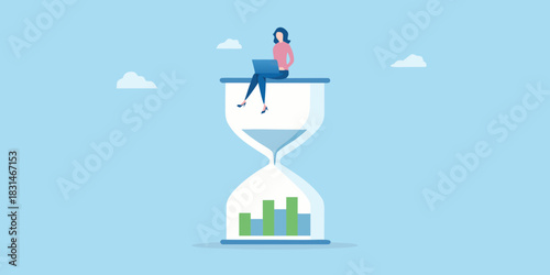 Woman working on laptop on hourglass with growth chart