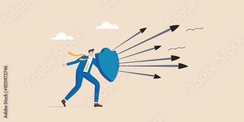 Businessman defends against incoming arrows with a shield