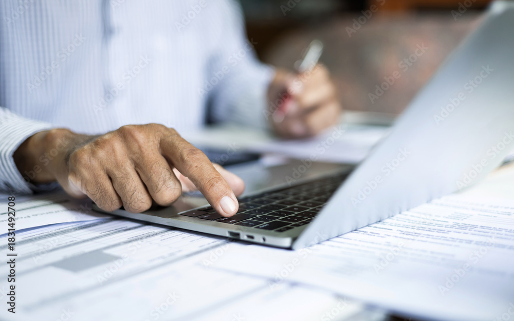 Fototapeta premium close up shot, asian businessman using laptop working and meeting online with business group checking documents, business contract and make business plan