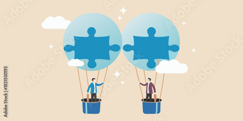 Two businessmen in hot air balloons holding puzzle pieces symbolizing teamwork