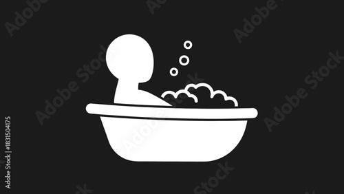 Person relaxing in a bathtub with bubbles, simple white icon on black background.