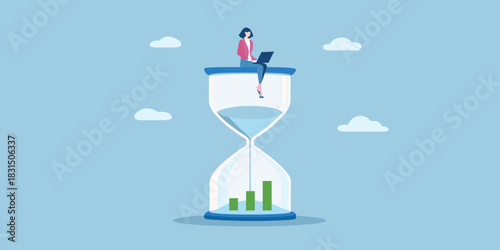 Woman working on laptop on top of hourglass with growth chart inside