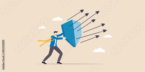 Businessman defending against incoming arrows with a shield