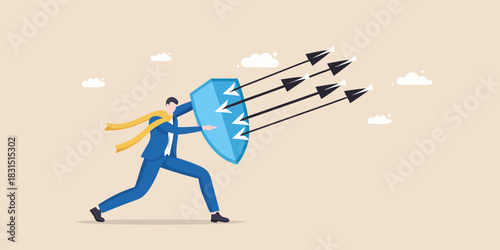 Businessman defends against incoming arrows with a shield