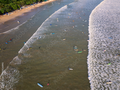 Aerial view of Weligama Beach with surfers riding the waves, Sri Lanka