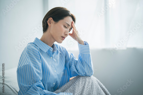 体調不良の女性