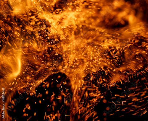 A fire with lots of sparks and smoke