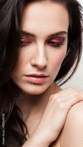 Elegant Woman with Dark Hair and Subtle Makeup Posing.