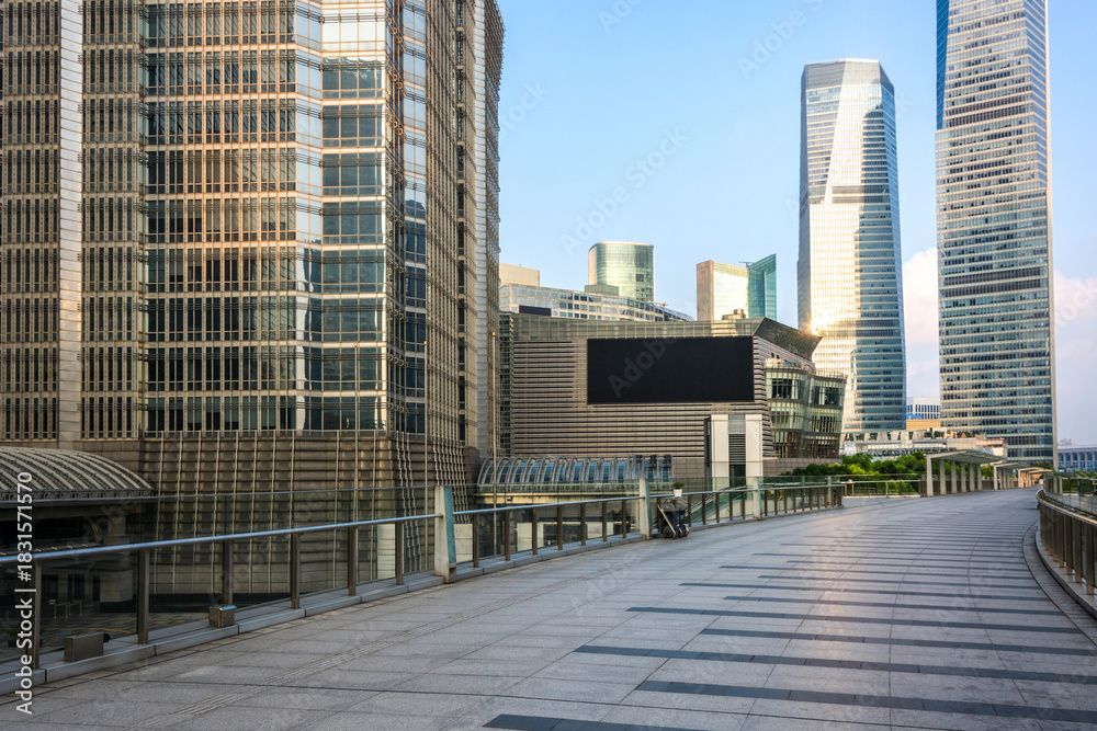 Fototapeta premium Modern Urban Skyline with Tall Glass Buildings and Walkway