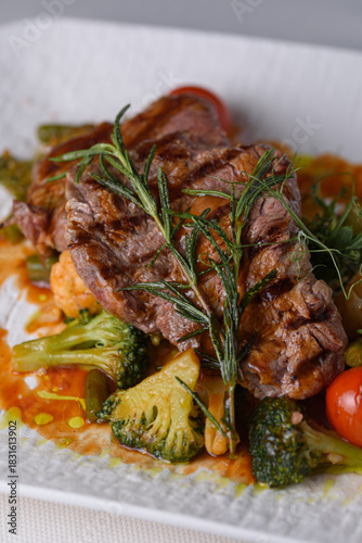 beef medallions with vegetables in sauce