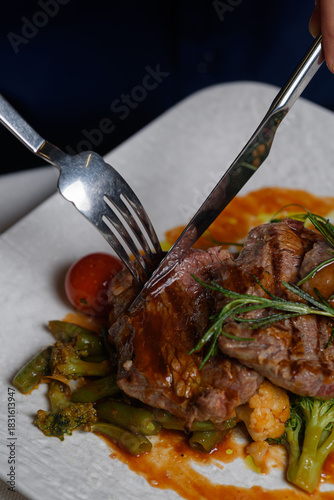 beef medallions with vegetables in sauce