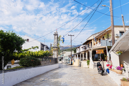 Fototapeta Naklejka Na Ścianę i Meble -  Main street view of a traditional town square in Kassiopi, Corfu, Greece