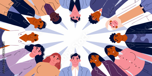 Diverse group of people standing in a circle looking downward together