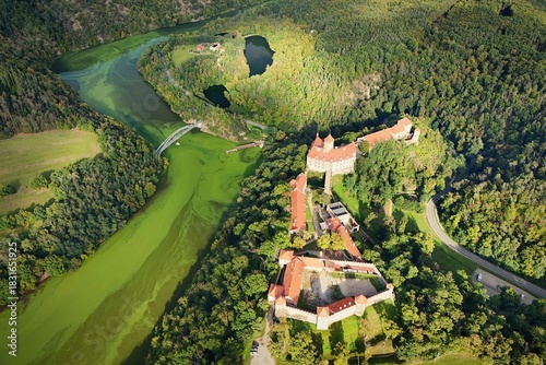 Beautiful autumn landscape with a castle from above from a drone. Beautiful Gothic castle Veveri. The city of Brno at the Brno dam. South Moravia - Czech Republic - Central Europe.