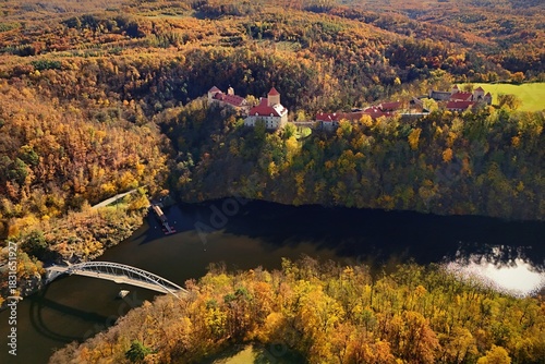 Beautiful autumn landscape with a castle from above from a drone. Beautiful Gothic castle Veveri. The city of Brno at the Brno dam. South Moravia - Czech Republic - Central Europe.