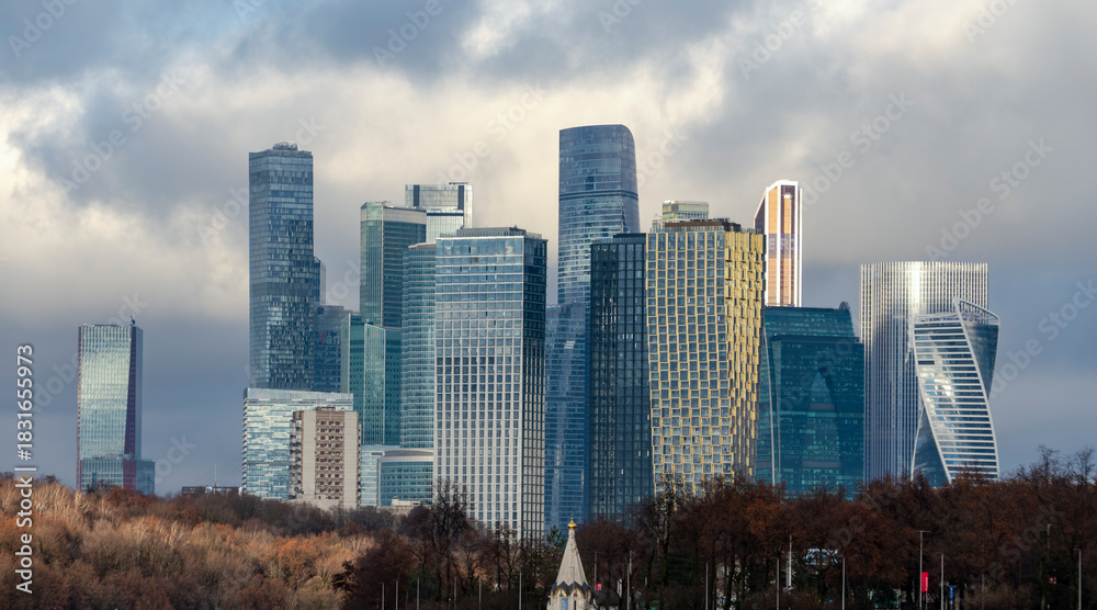 Obraz premium Moscow-City modern skyline with river and autumn foliage