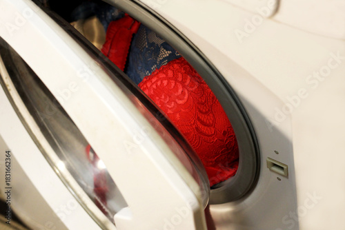Red women's lingerie and an automatic washing machine.