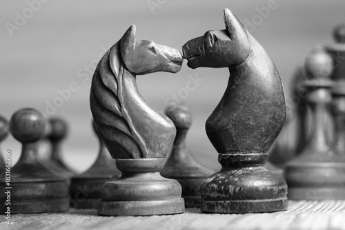 Old retro wooden chess pieces, intellectual strategy game.
