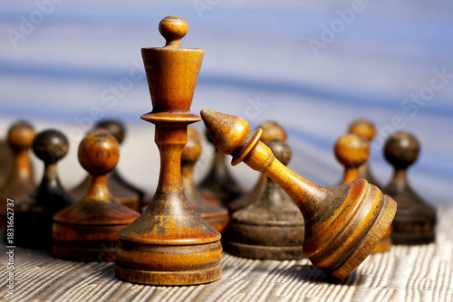 Old retro wooden chess pieces, intellectual strategy game.