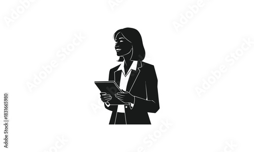 Silhouette of a businesswoman holding a tablet.